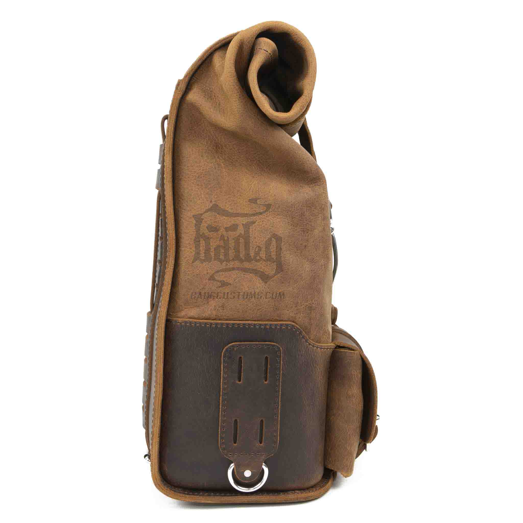 Upgrade your ride with the URB01 Rolltop Backpack Saddlebag. Unique design enables quick conversion from saddlebag to backpack. Hand crafted in USA with premium veg tan water buffalo leather and stainless steel hardware. Durable and stylish, it's the perfect fit for your motorcycle.