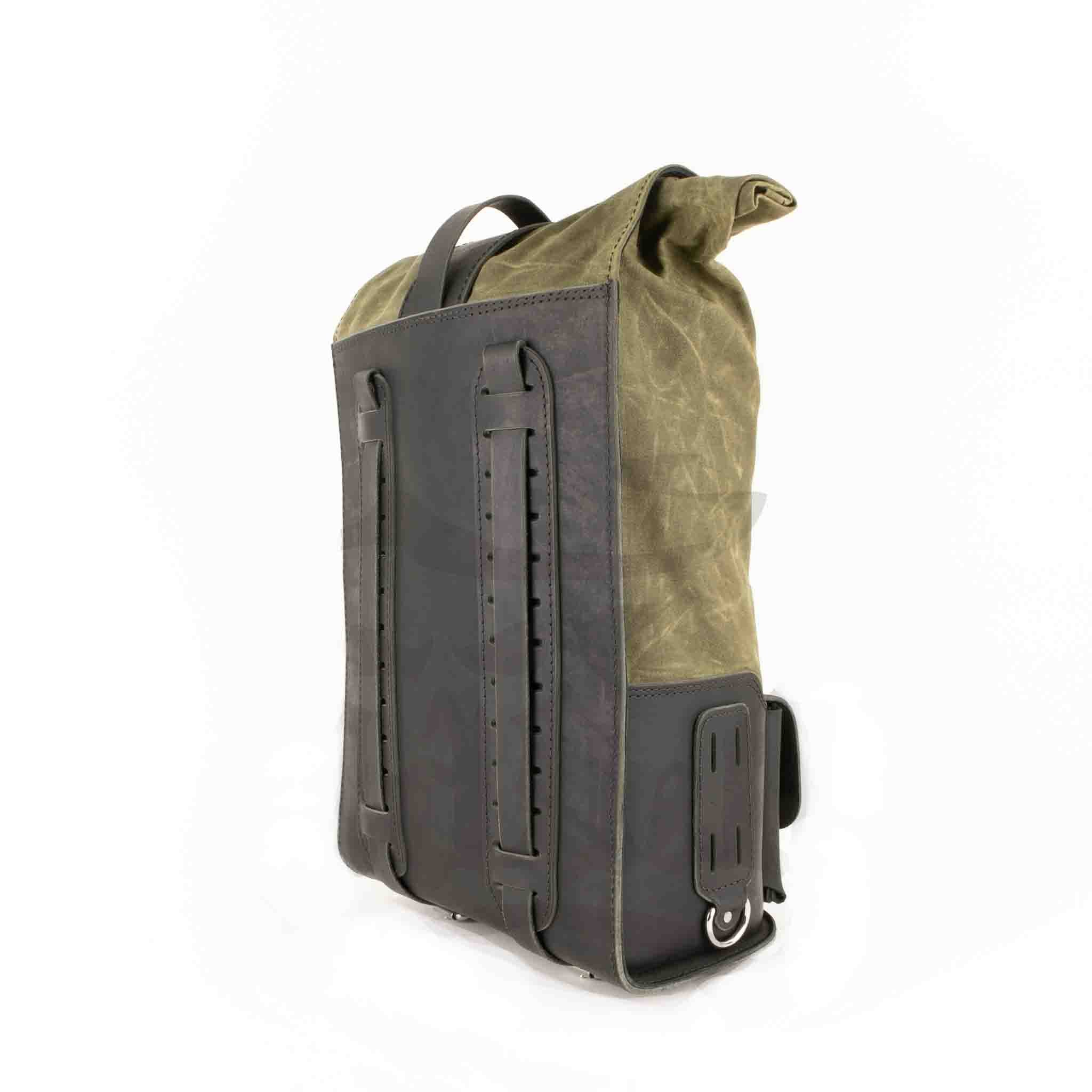Upgrade your ride with the URB02 Rolltop Backpack Saddlebag. Unique design enables quick conversion from saddlebag to backpack. Hand crafted in USA with premium veg tan water buffalo leather, waxed canvas and stainless steel hardware. Durable and stylish, it's the perfect fit for your motorcycle.